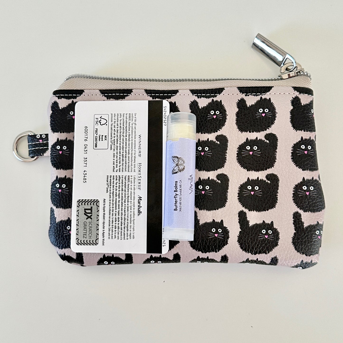 coin purse with a black cat pattern on a light background