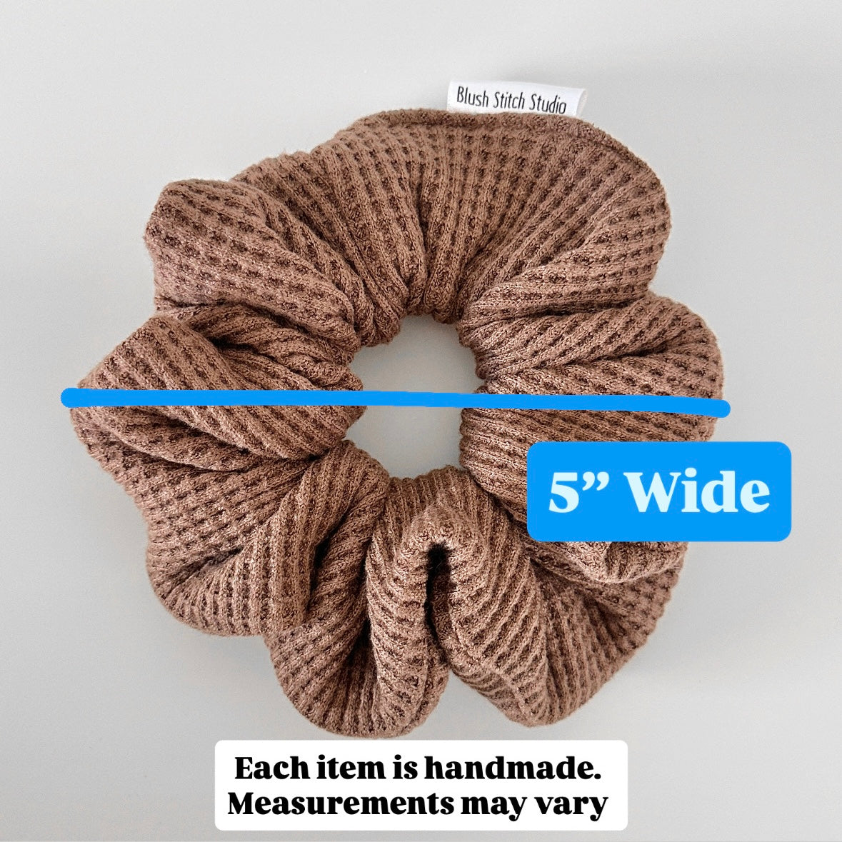Brown scrunchie with a measurement label indicating it is 5 inches wide on a white background.