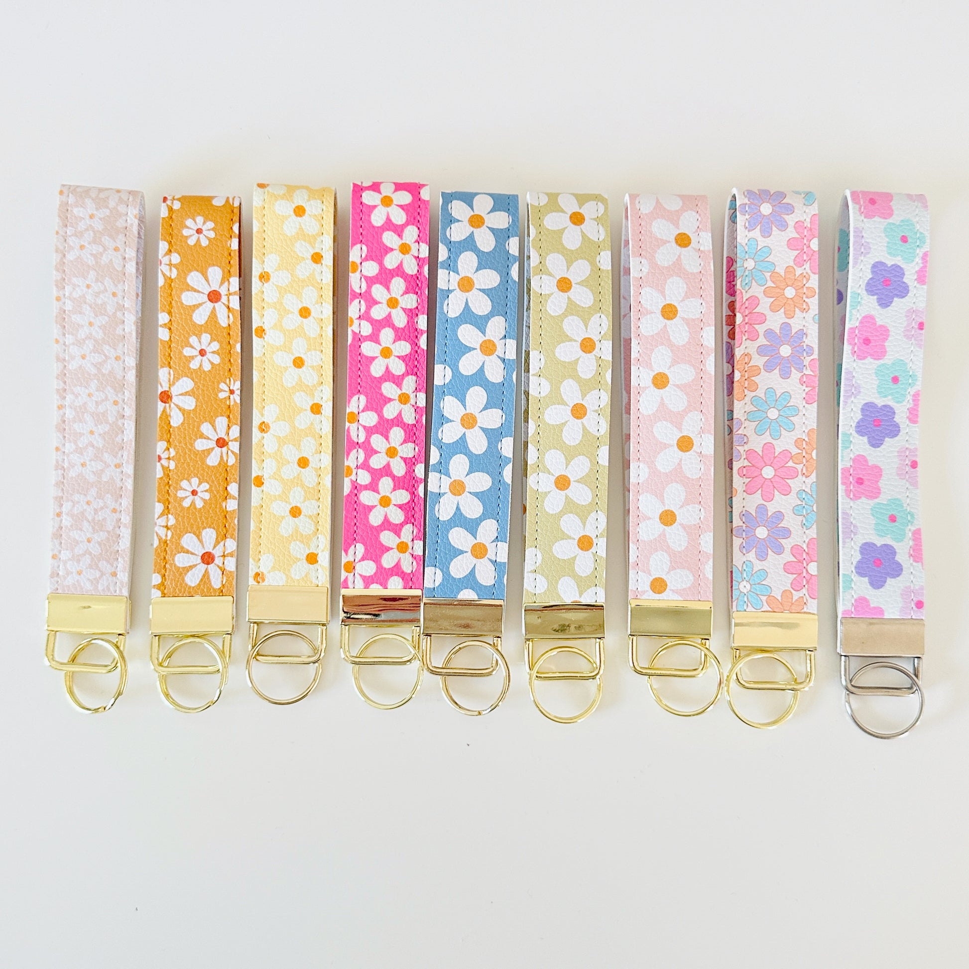 Set of colorful floral key wristlets  on a white background
