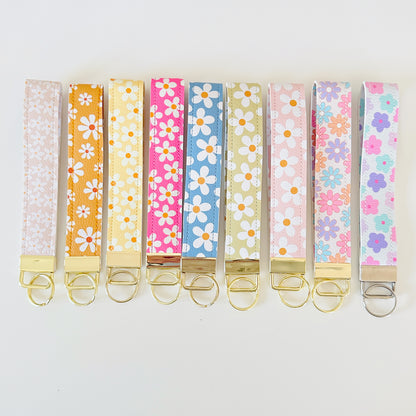 Set of colorful floral key wristlets  on a white background