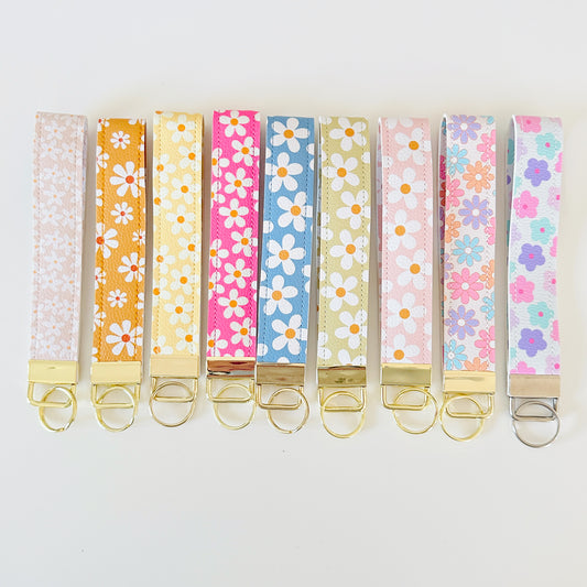 Set of colorful floral key wristlets  on a white background
