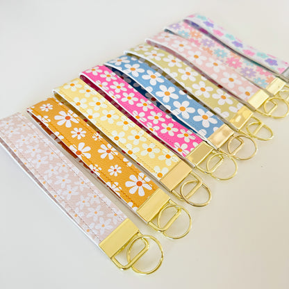floral daisy vegan leather key wristlets, blue green yellow and pink