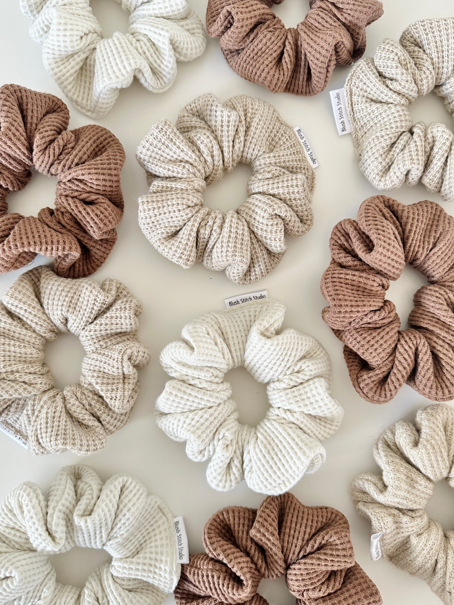 waffle scrunchies in various neutral colors on a light background