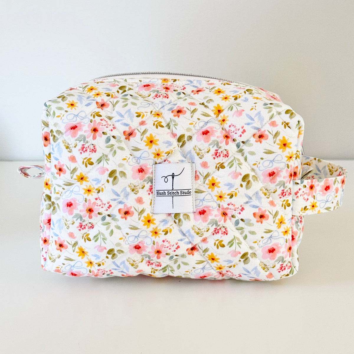white floral quilted makeup cosmetic bag. made in canada