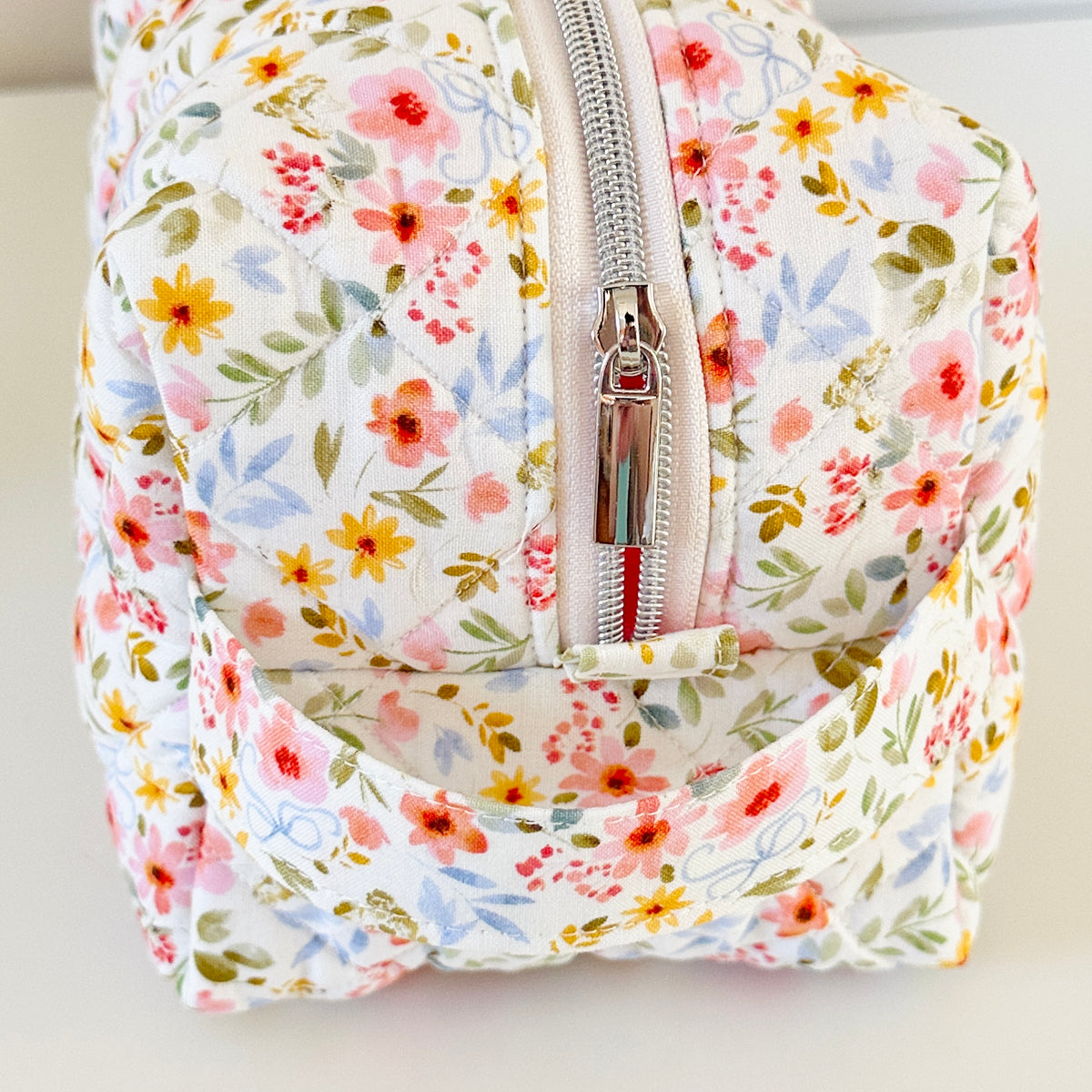 white floral quilted makeup cosmetic bag. made in canada