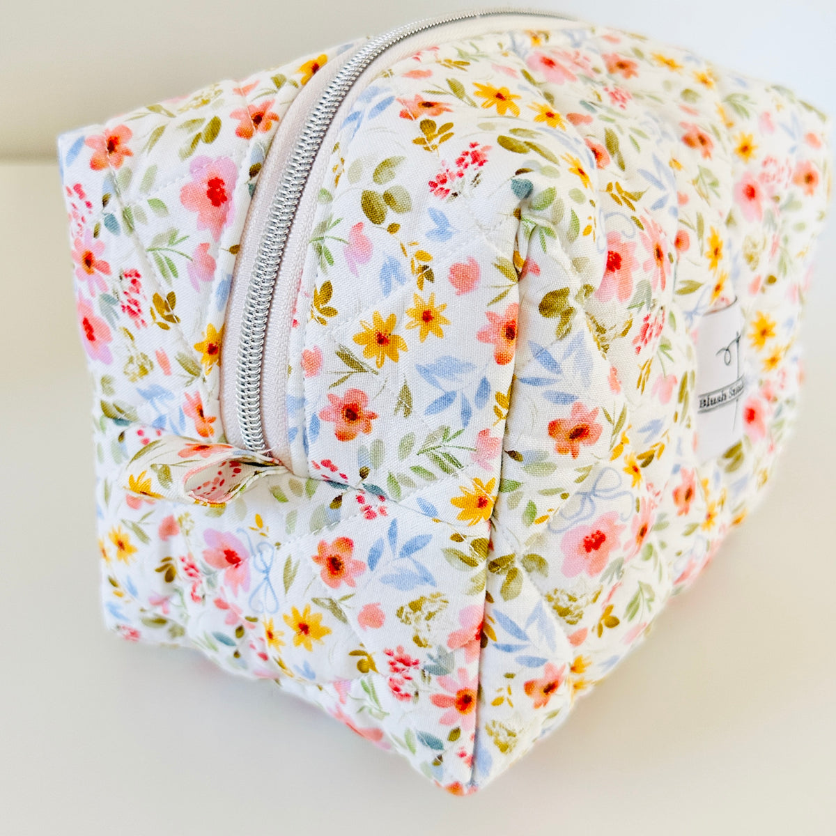white floral quilted makeup cosmetic bag. made in canada