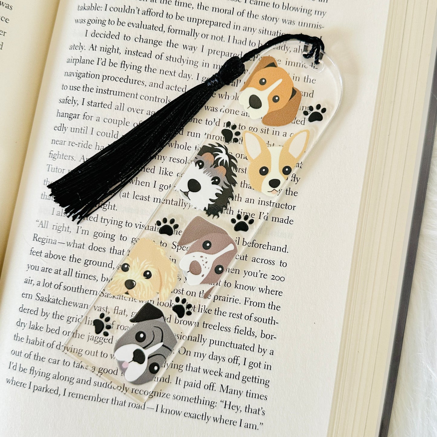 Bookmark with dog illustrations on a book page
