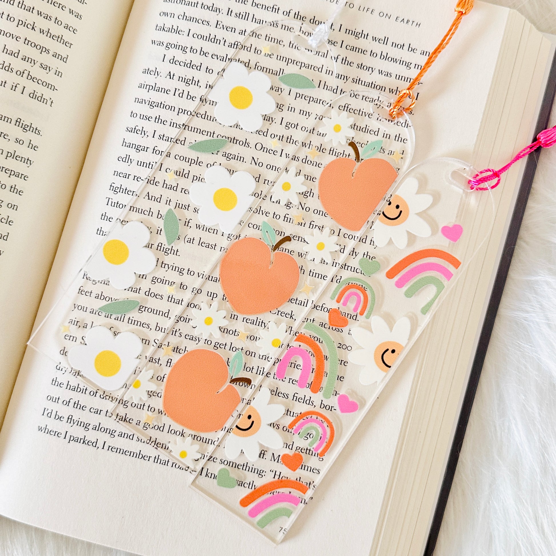 Decorative bookmark with heart designs on an open book