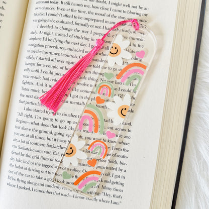 Decorative bookmark with smiley face design on an open book