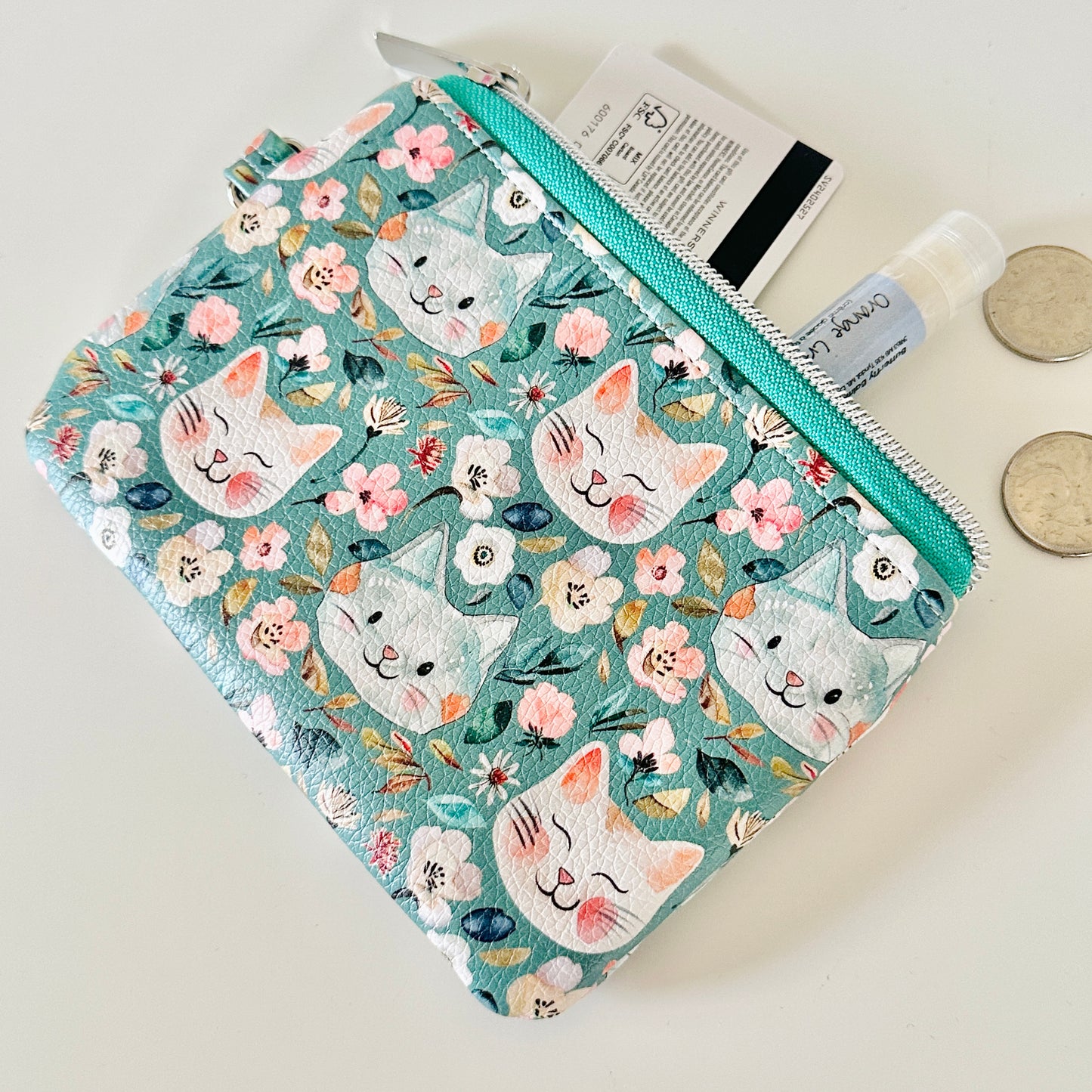 coin purse with cat and floral pattern on a white background