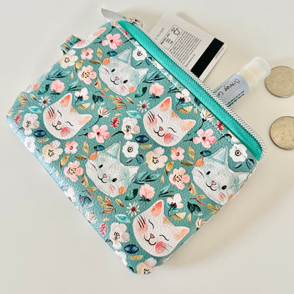coin purse with cat and floral pattern on a white background