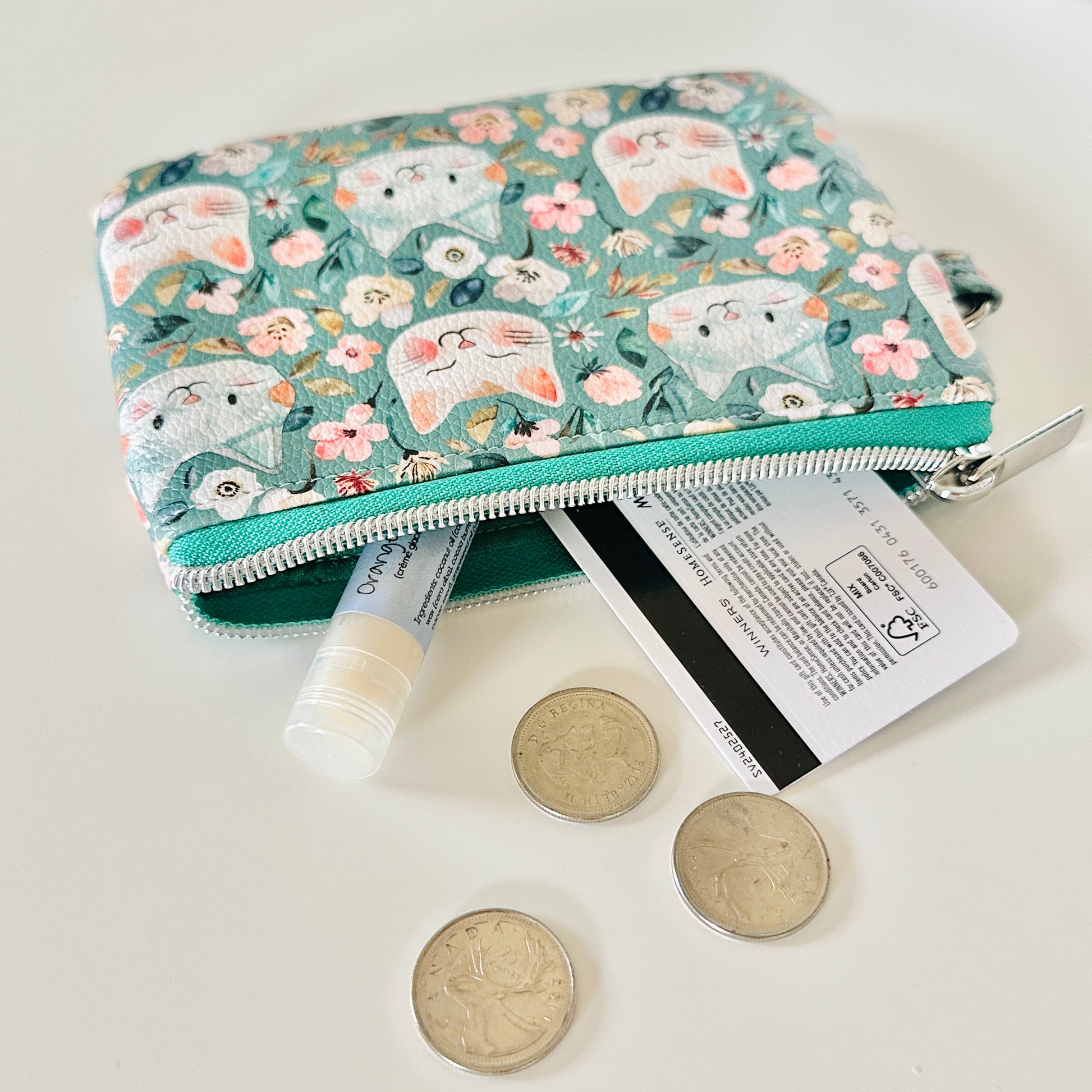 coin purse with cat and floral pattern on a white background