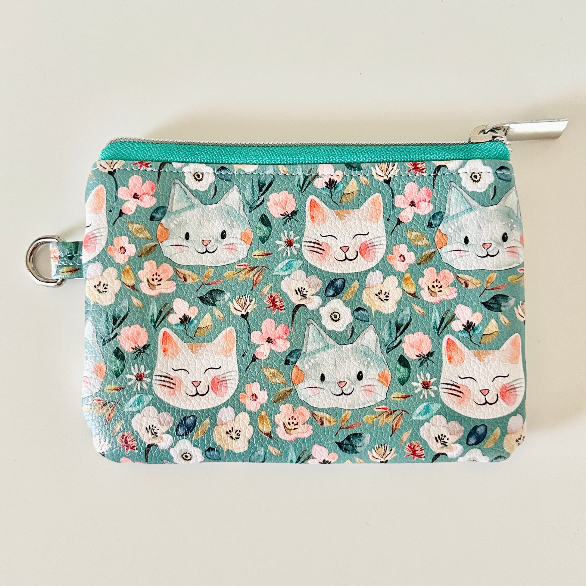 coin purse with cat and floral pattern on a white background