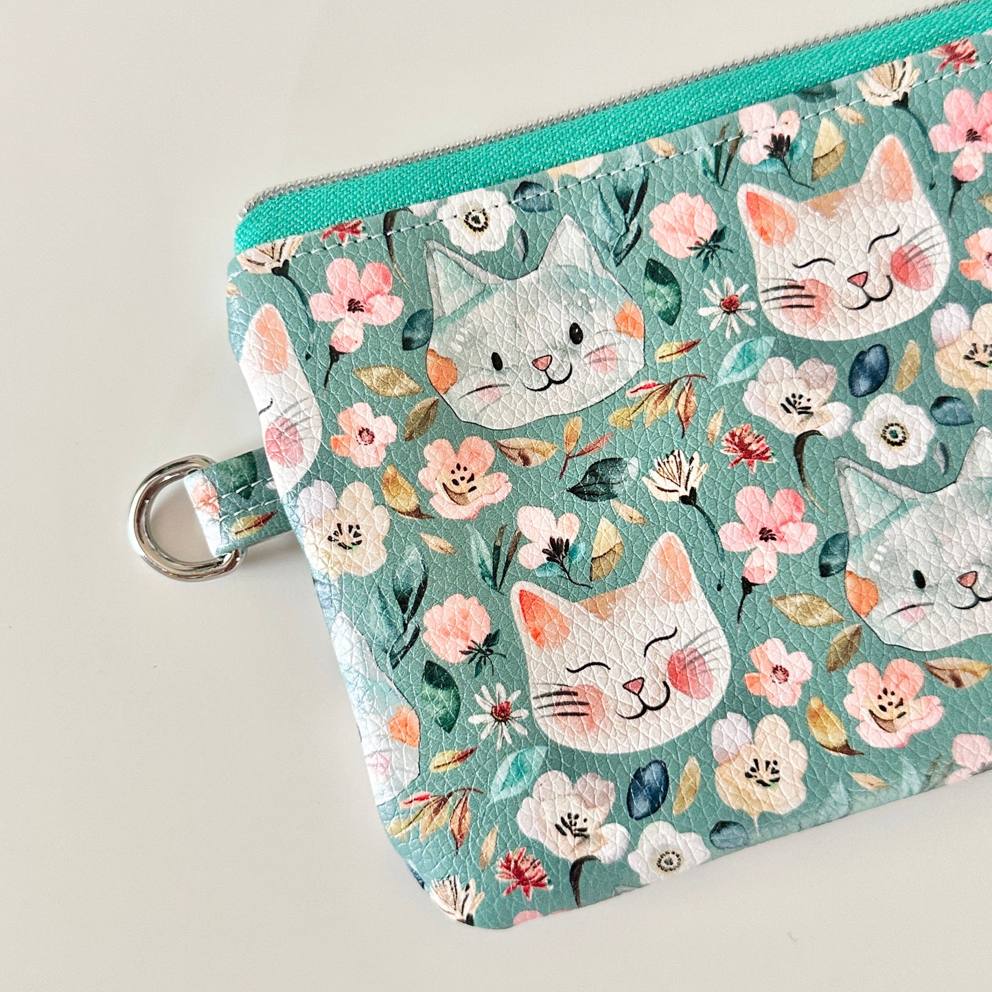 coin purse with cat and floral pattern on a white background