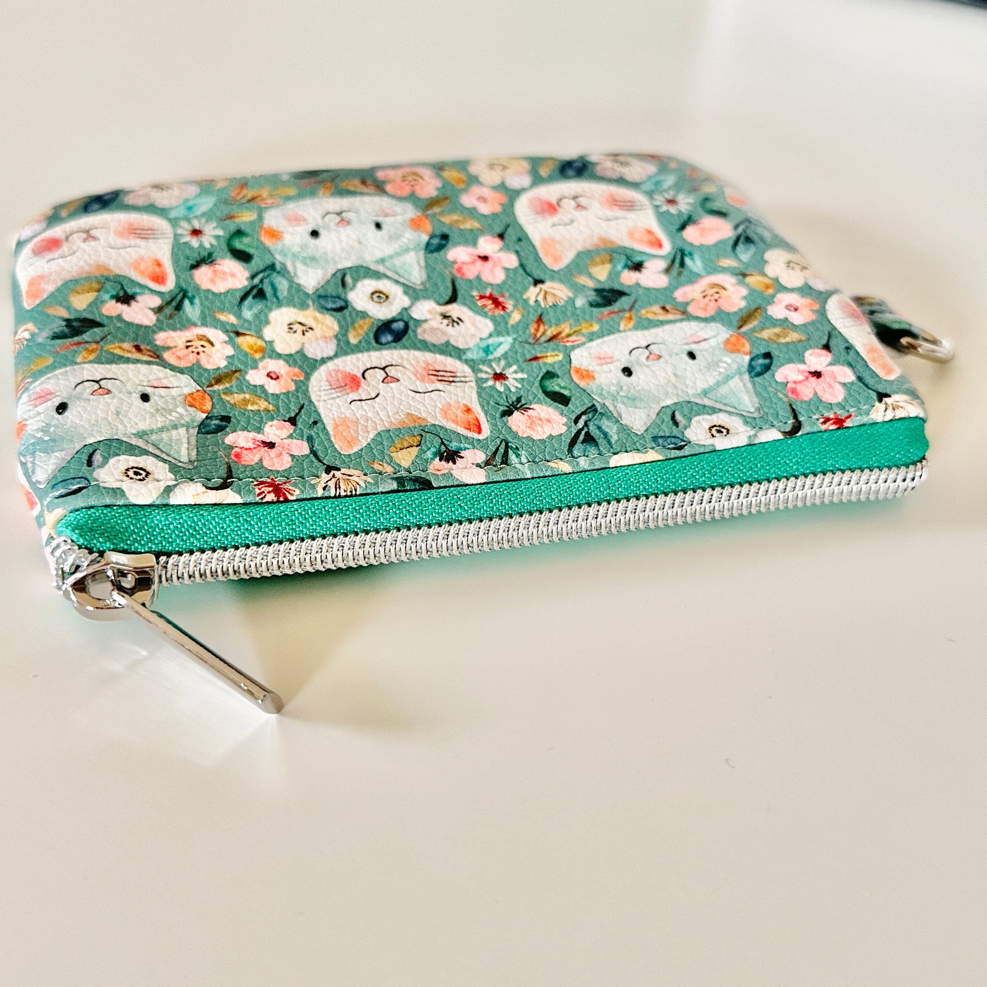 coin purse with cat and floral pattern on a white background