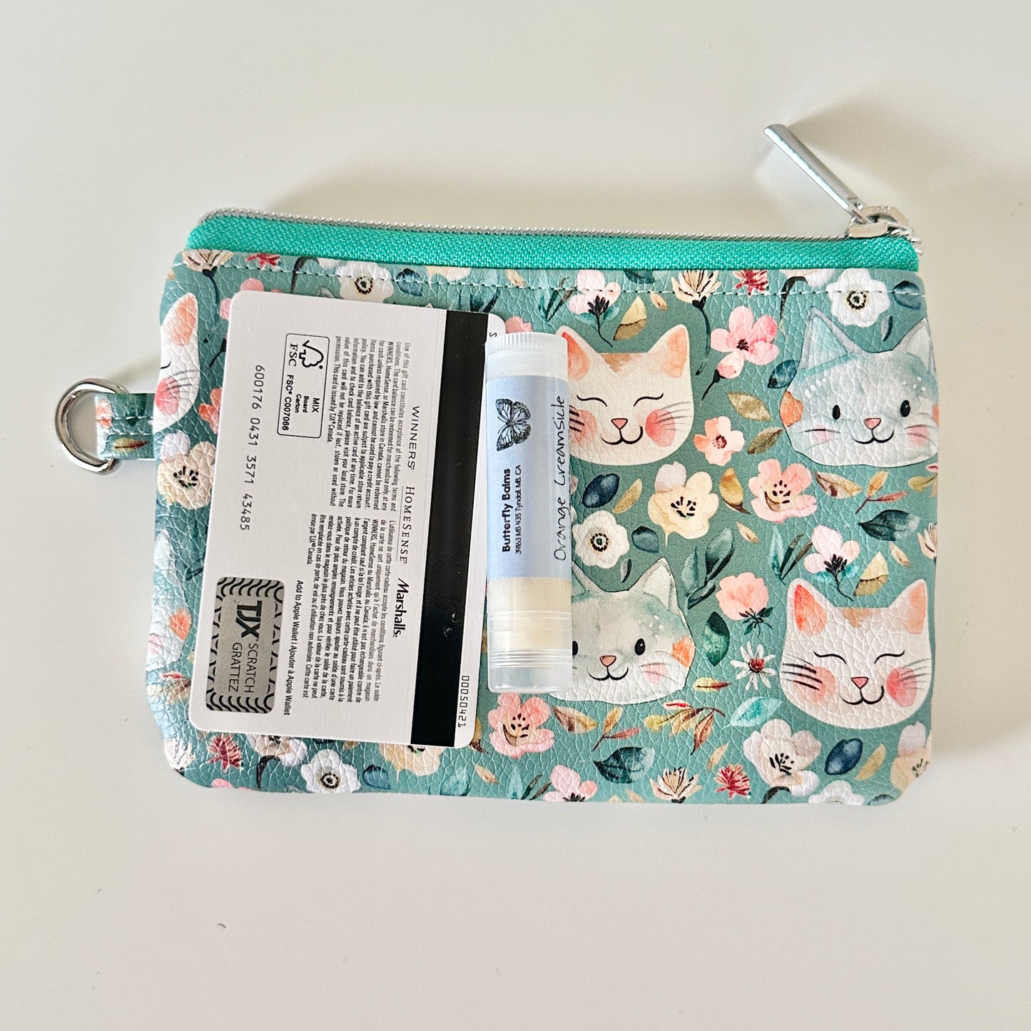 coin purse with cat and floral pattern on a white background