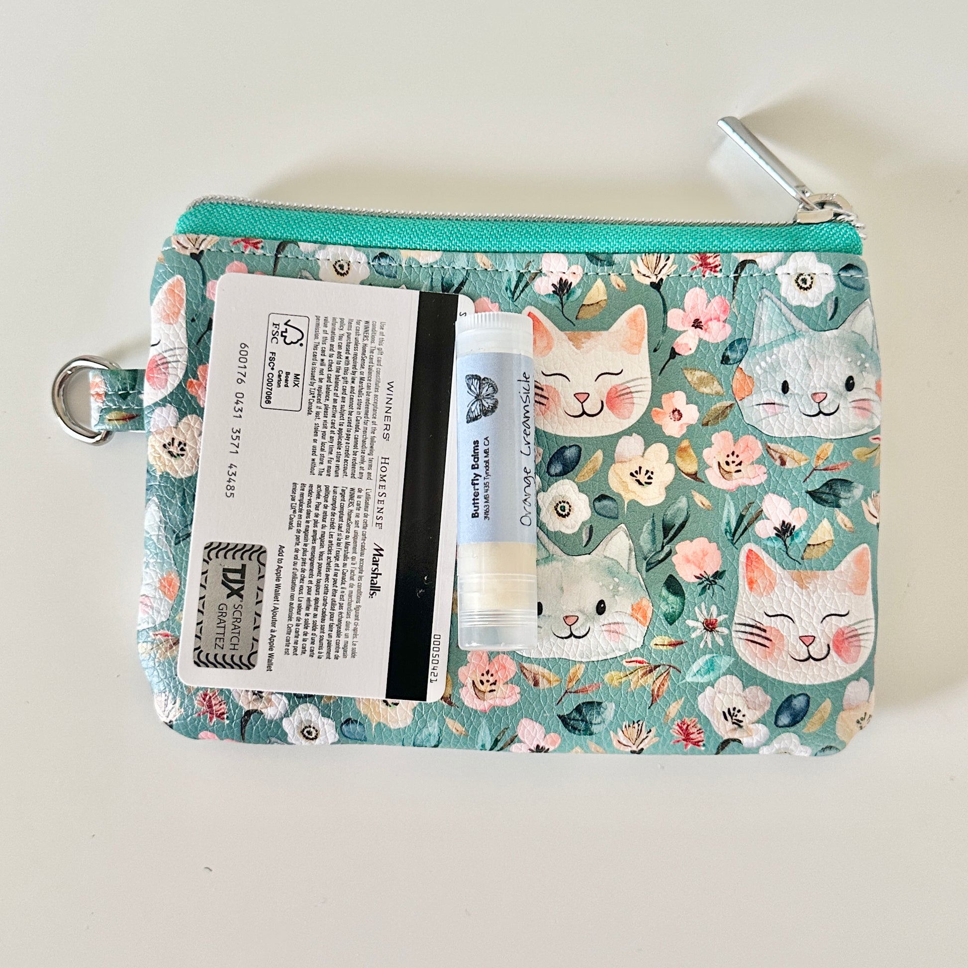 coin purse with cat and floral pattern on a white background
