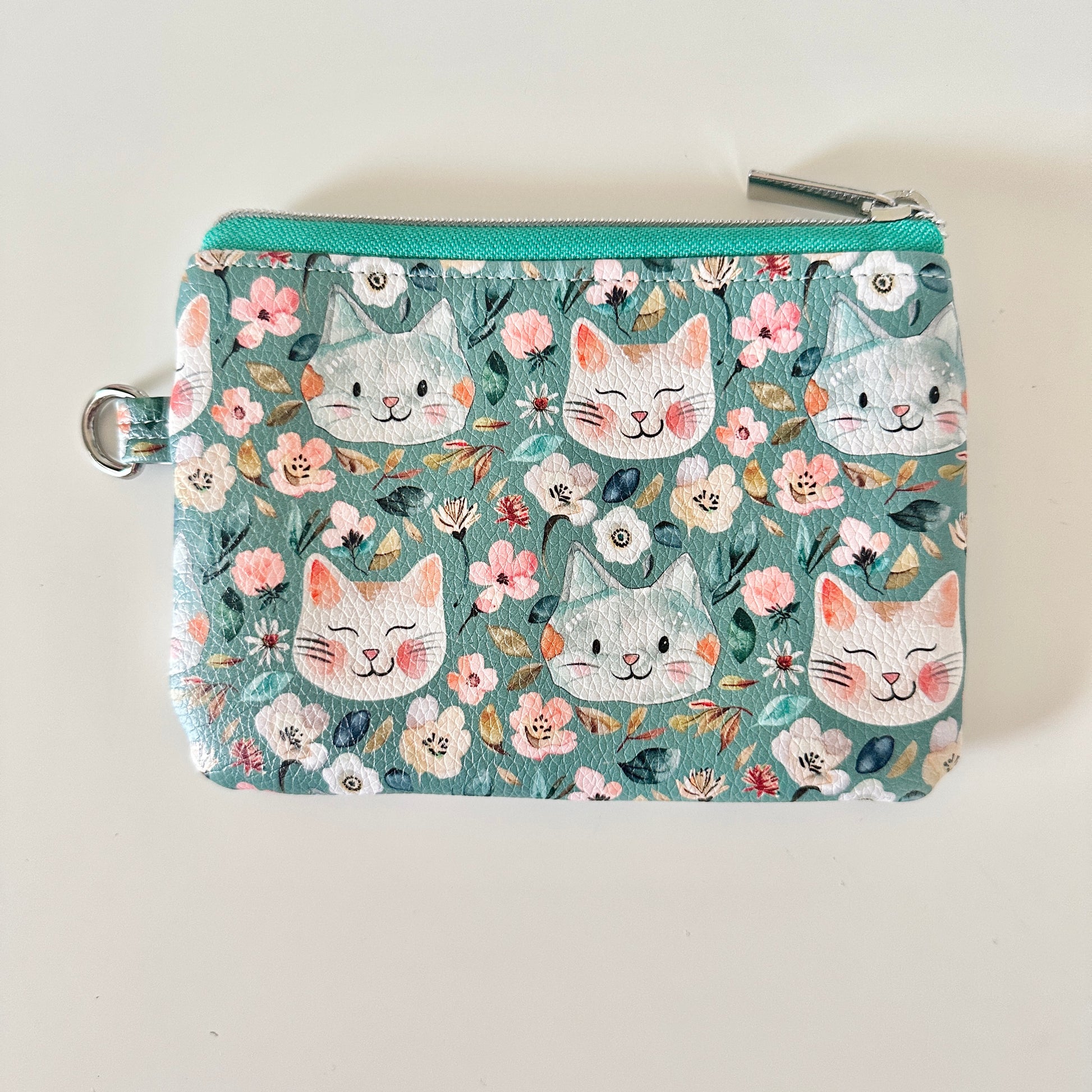 coin purse with cat and floral pattern on a white background