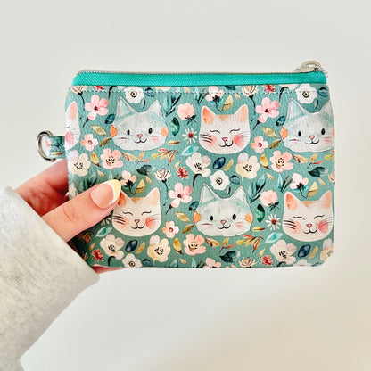 coin purse with cat and floral pattern on a white background