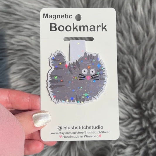 grey Cat-shaped magnetic bookmark on a Blush Stitch Studio card against a textured gray background