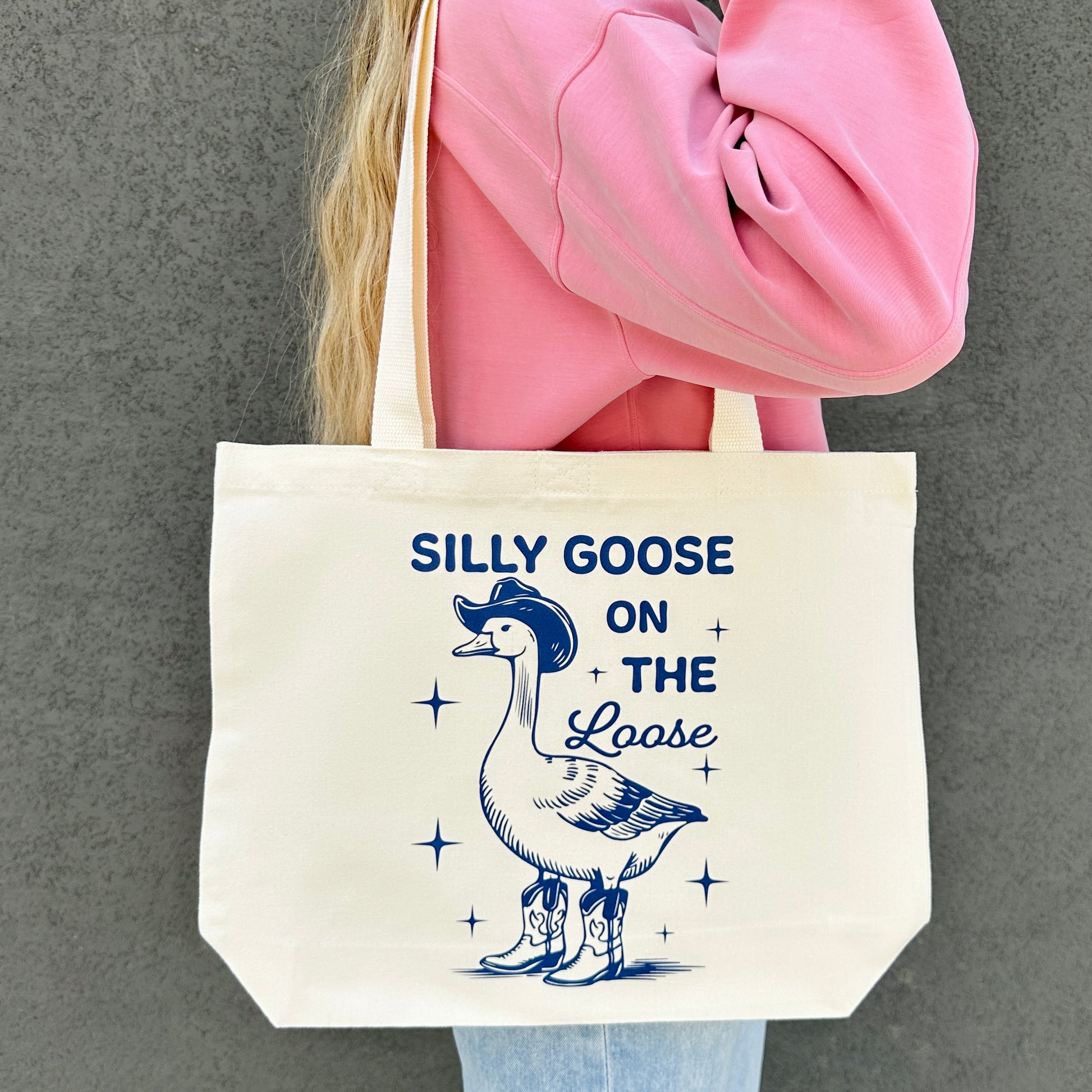 Tote bag with a silly goose on the loose graphic and text on a gray background