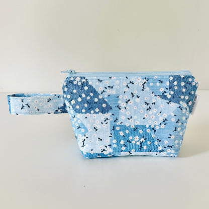  blue floral fabric pouches on a light background