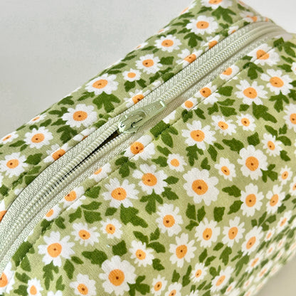Floral-patterned pouch with a zipper on a light gray background