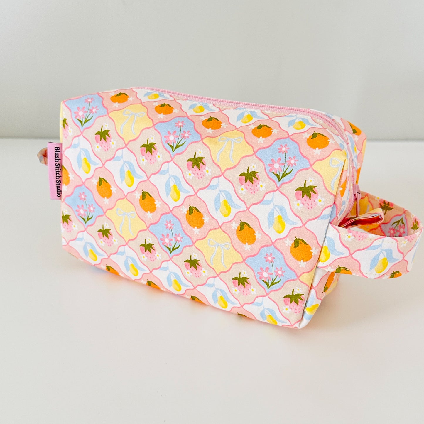 coquette fruit  fabric bag with floral and fruit pattern on a white background