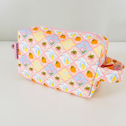 coquette fruit  fabric bag with floral and fruit pattern on a white background