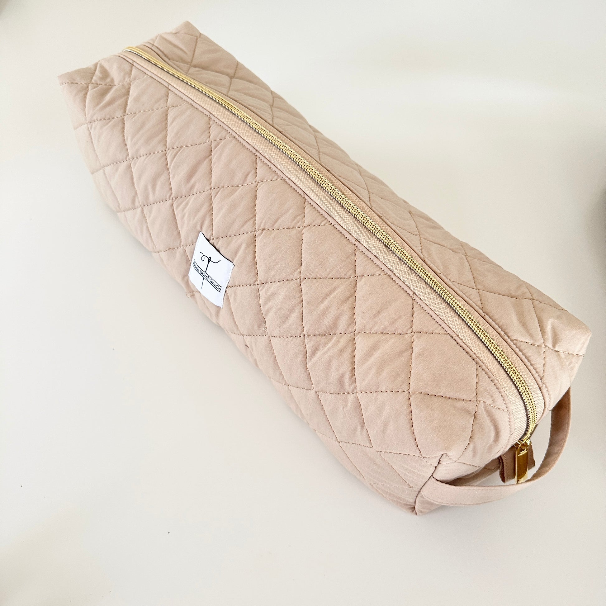 beige hair tool bag