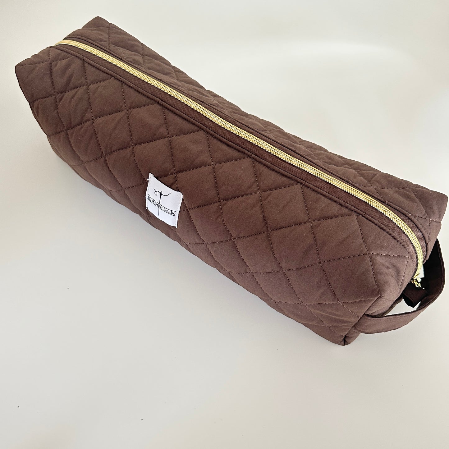 brown quilted hair tool bag