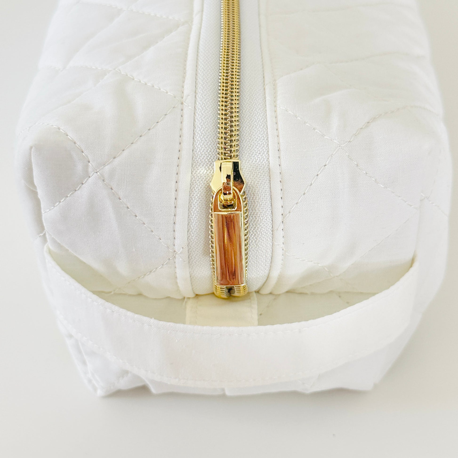 Ivory quilted hair tool bag