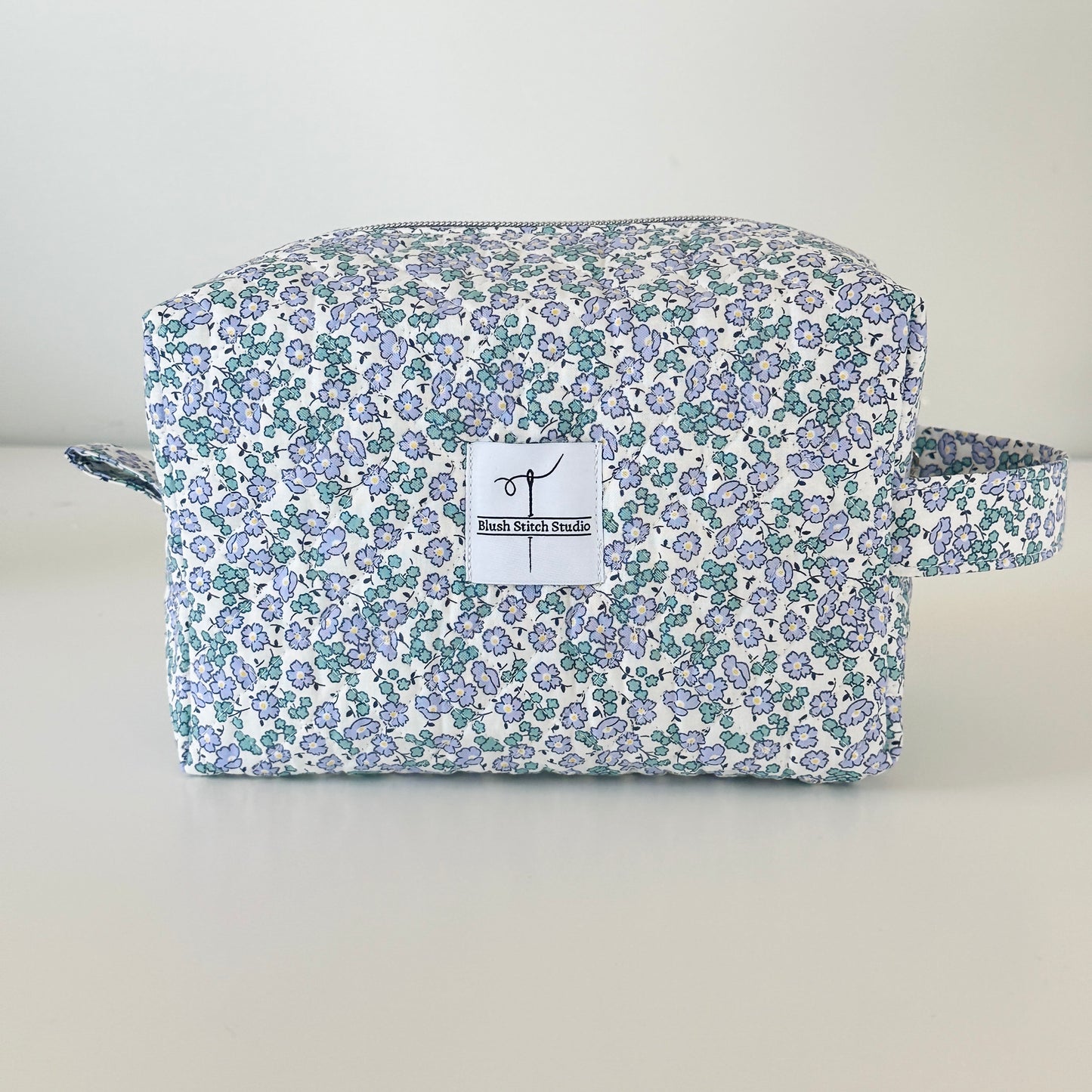 Blue Floral Quilted Makeup bag. Made in Canada