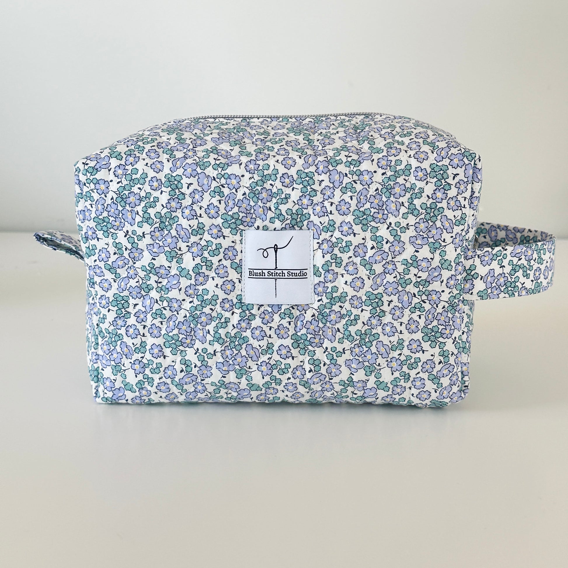 Blue Floral Quilted Makeup bag. Made in Canada