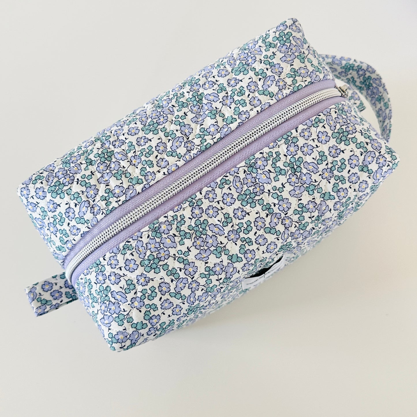 Blue Floral Quilted Makeup bag. Made in Canada