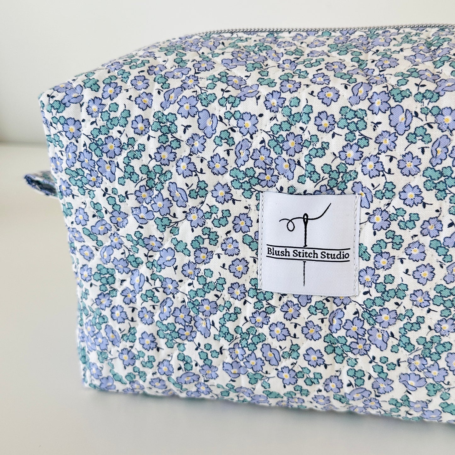 Blue Floral Quilted Makeup bag. Made in Canada