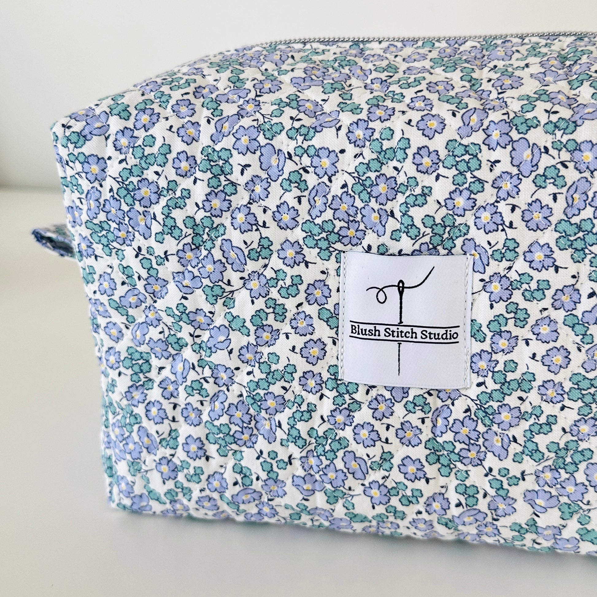 Blue Floral Quilted Makeup bag. Made in Canada