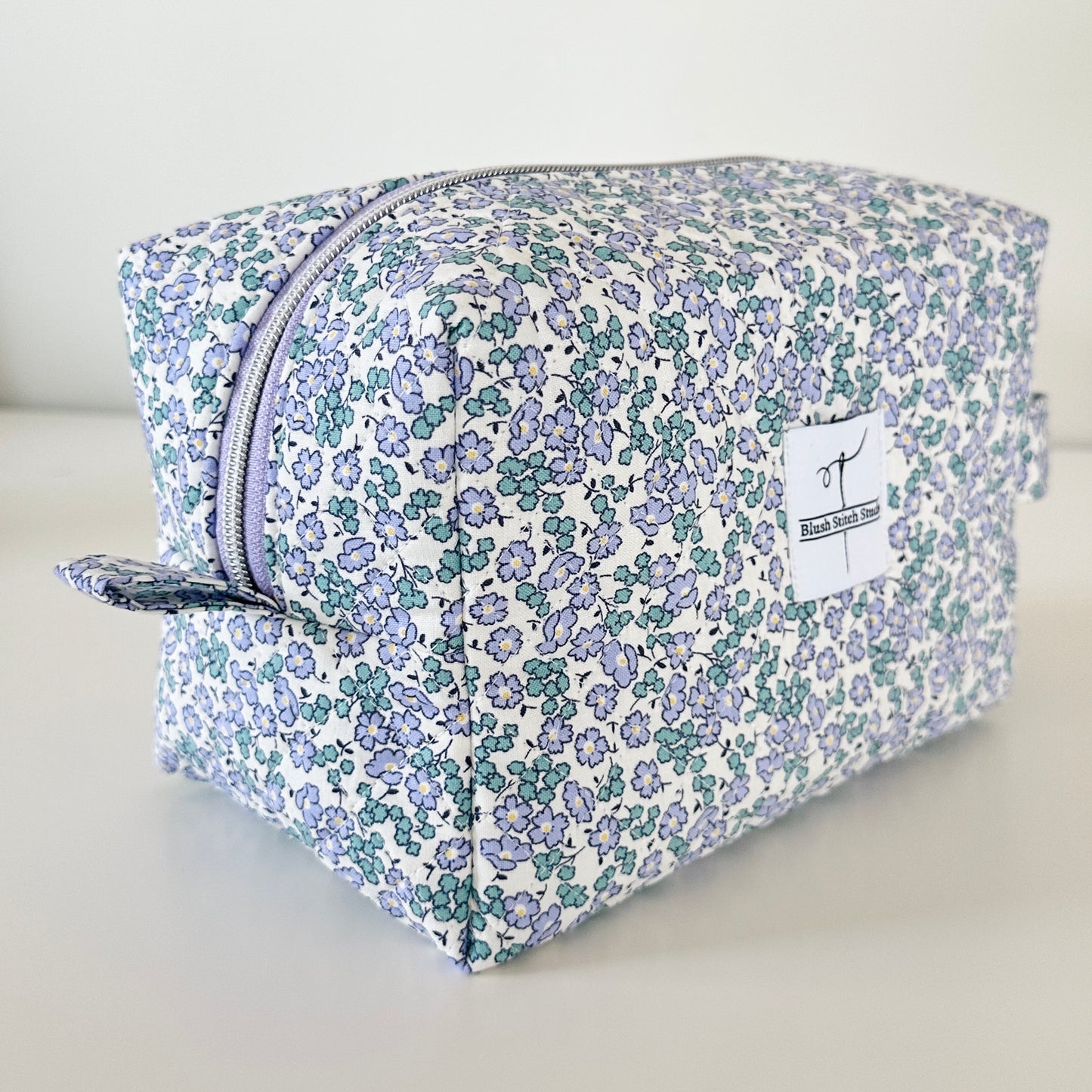 Blue Floral Quilted Makeup bag. Made in Canada