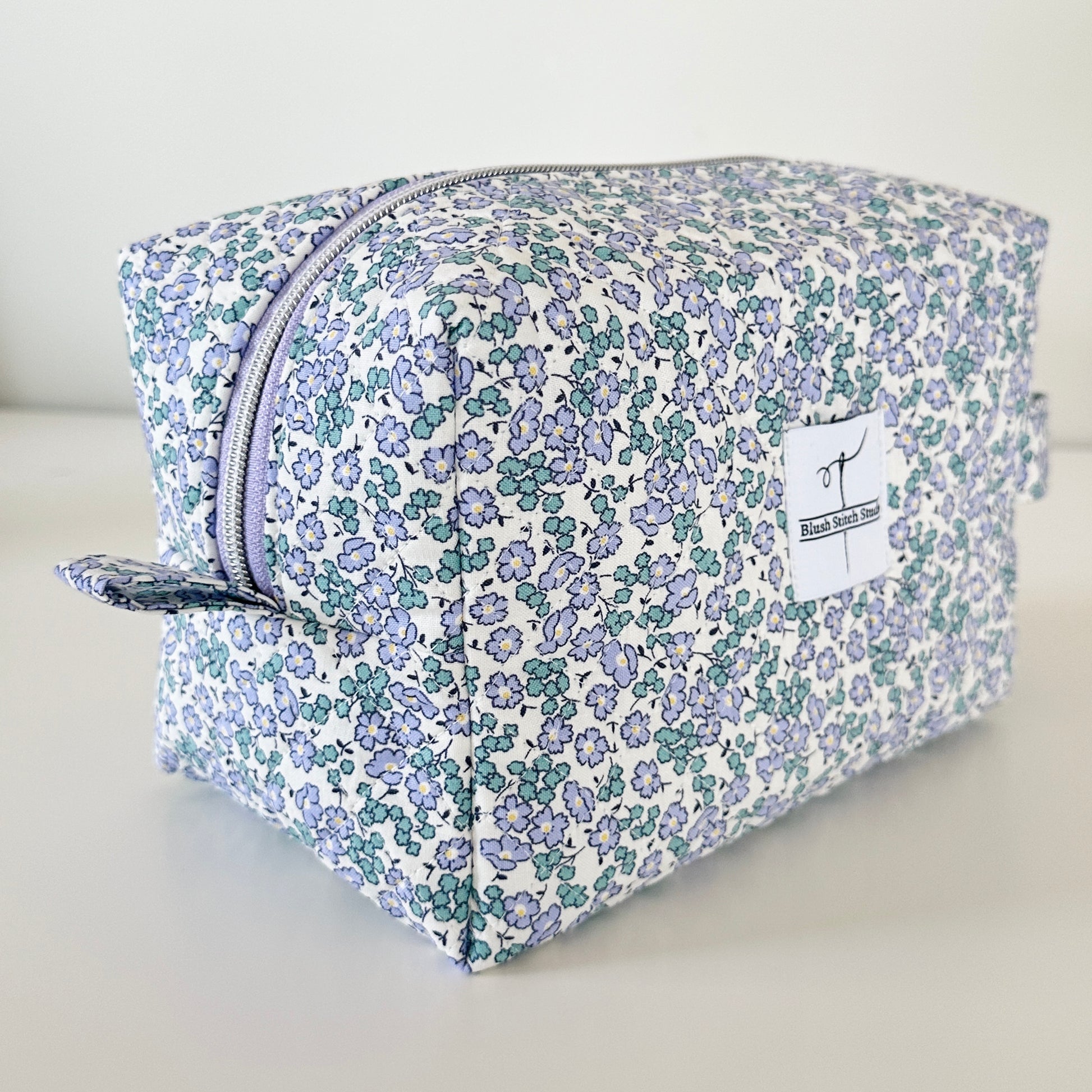 Blue Floral Quilted Makeup bag. Made in Canada