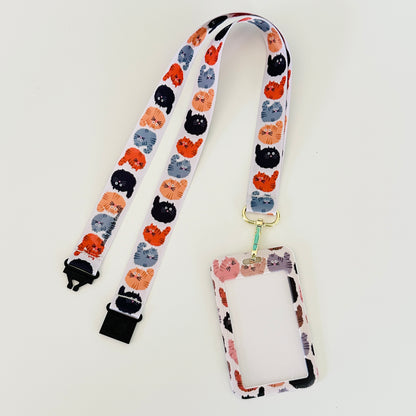 Lanyard with cat pattern and attached cardholder on a white background