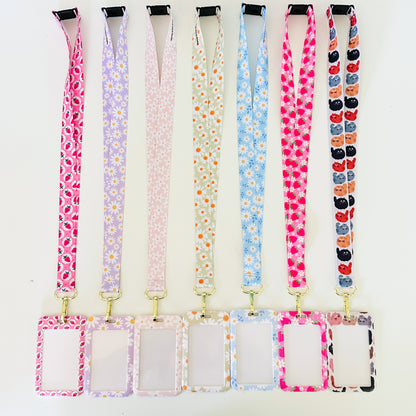 Set of colorful lanyards with attached matching ID holders on a white background