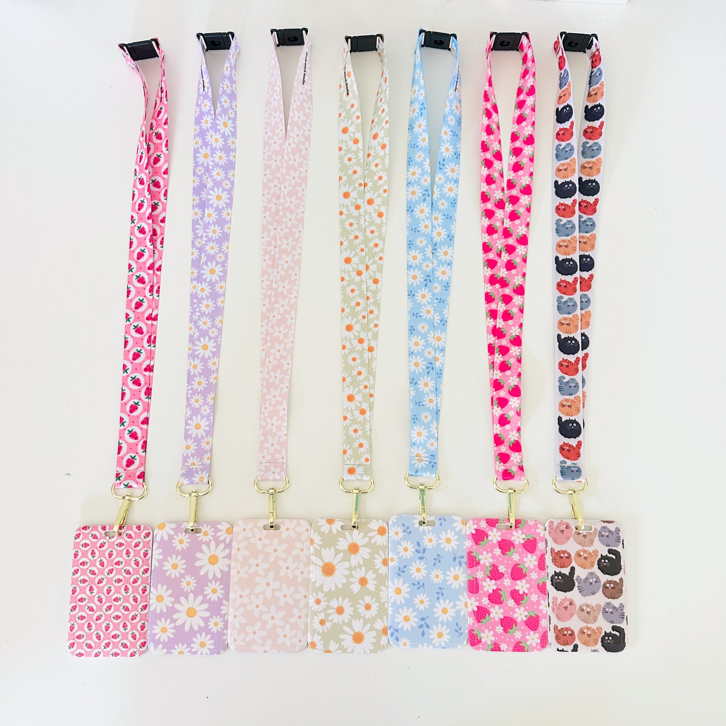 Set of colorful daisy floral  lanyards with various patterns on a white background