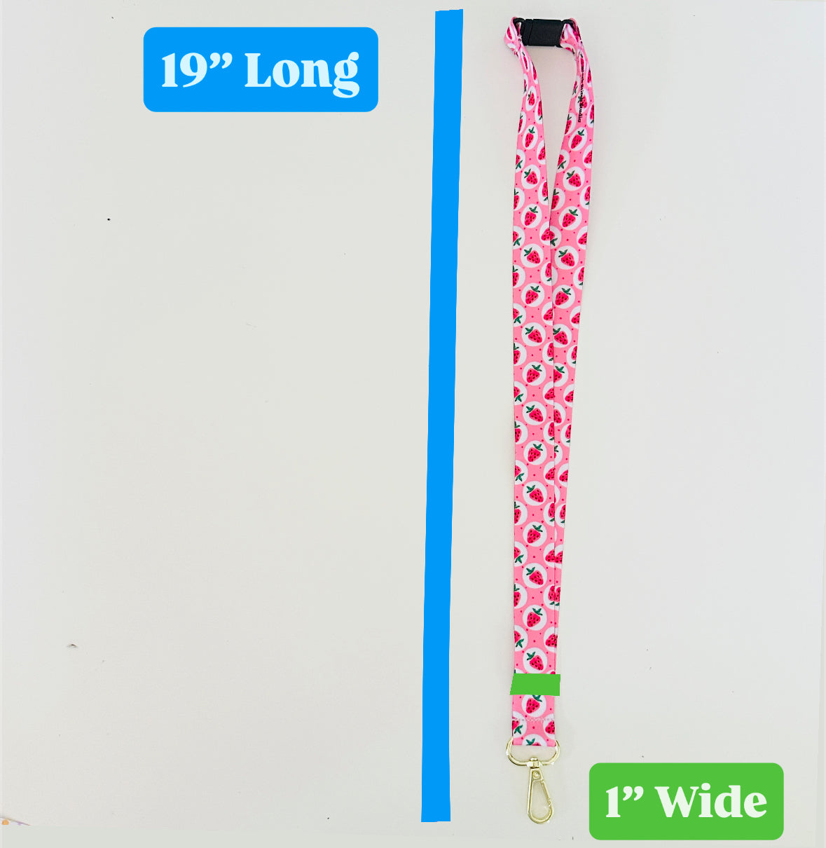 Pink strawberry patterned lanyard with measurements on a white background