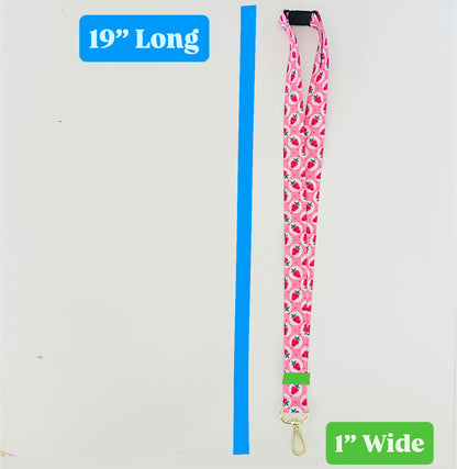 Pink strawberry patterned lanyard with measurements on a white background