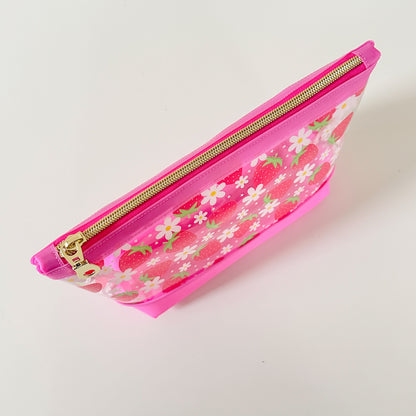 clear makeup bag with a pink strawberry pattern
