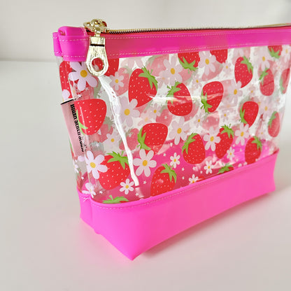 clear makeup bag with a pink strawberry pattern