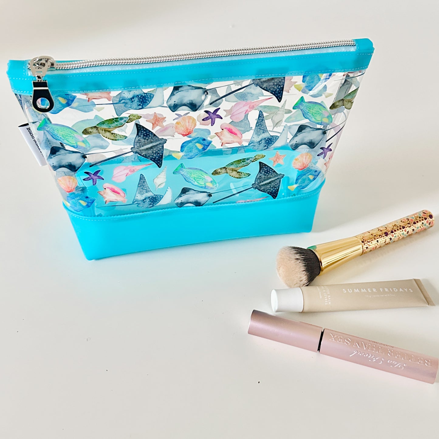 clear makeup bag with a tropical fish and stingray pattern 