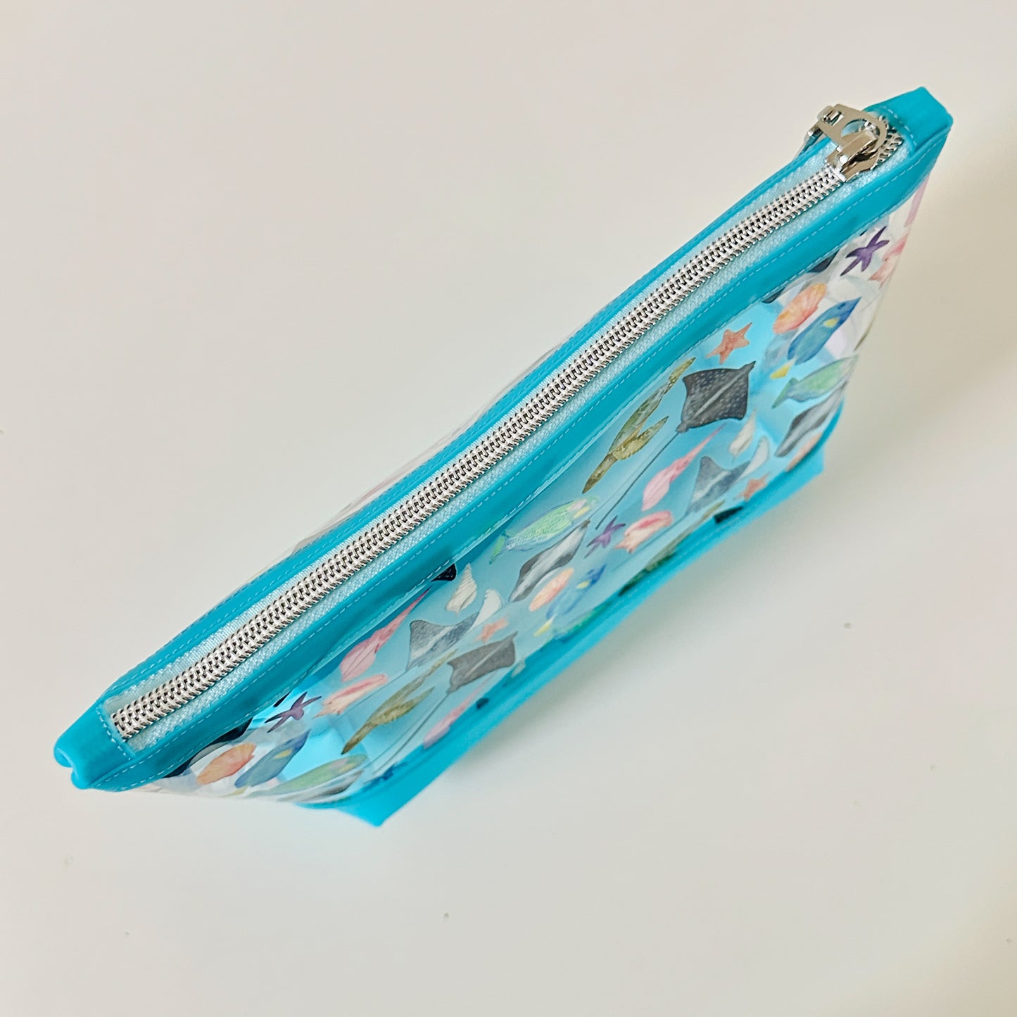clear makeup bag with a tropical fish and stingray pattern 