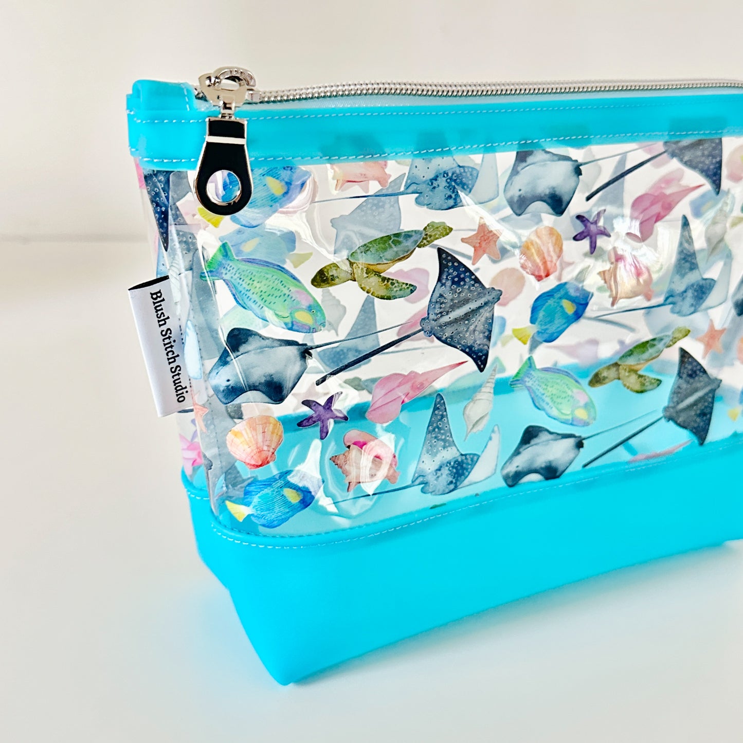 clear makeup bag with a tropical fish and stingray pattern 