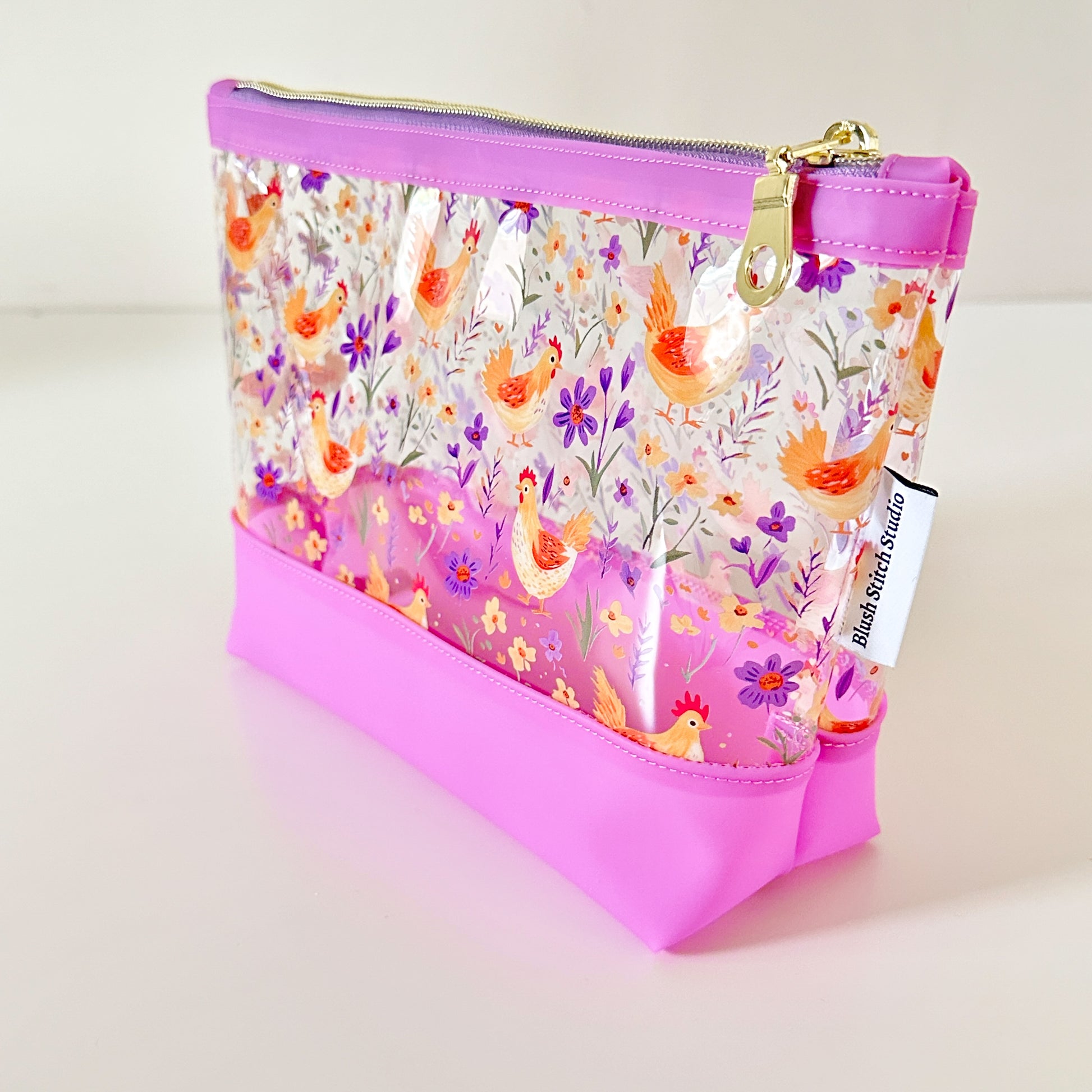 Clear makeup bag with chicken and floral pattern 